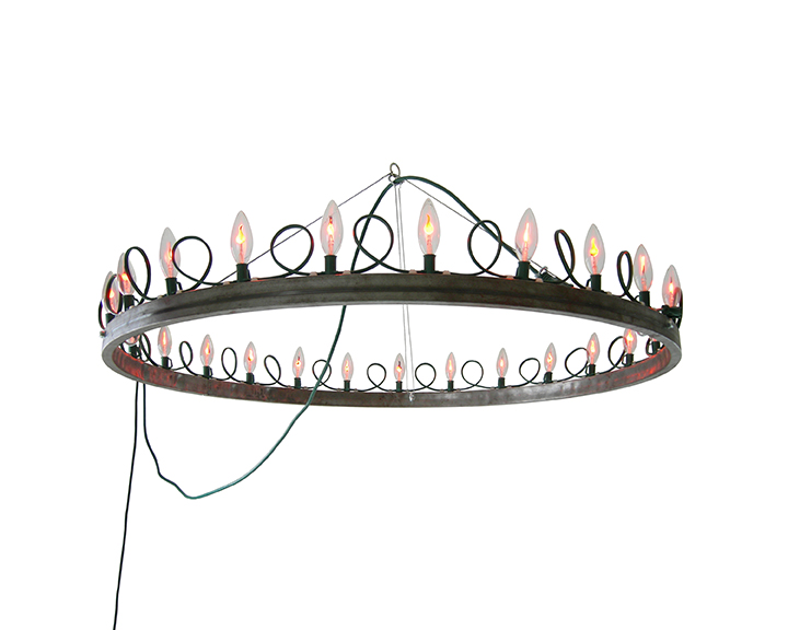 The Arthur Chandelier by Kennedy Telford. Flicker Flame bulbs arranged around a steel ring form a circle of flickering, regal light. Contemporary art, design, and objects from Oscar & Kennedy.